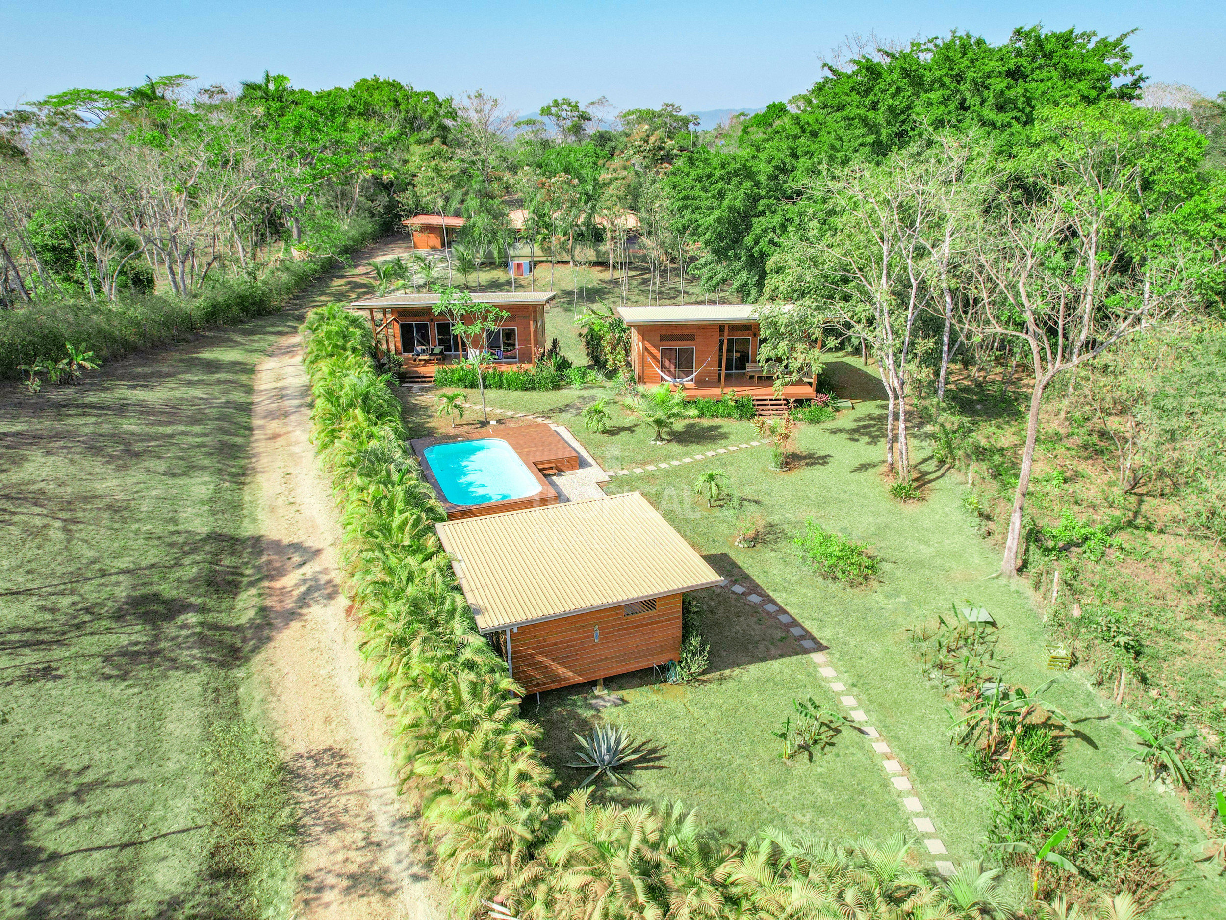 Turnkey Rental Opportunity: Charming Lodges with Pool Near Santa Teresa Beach