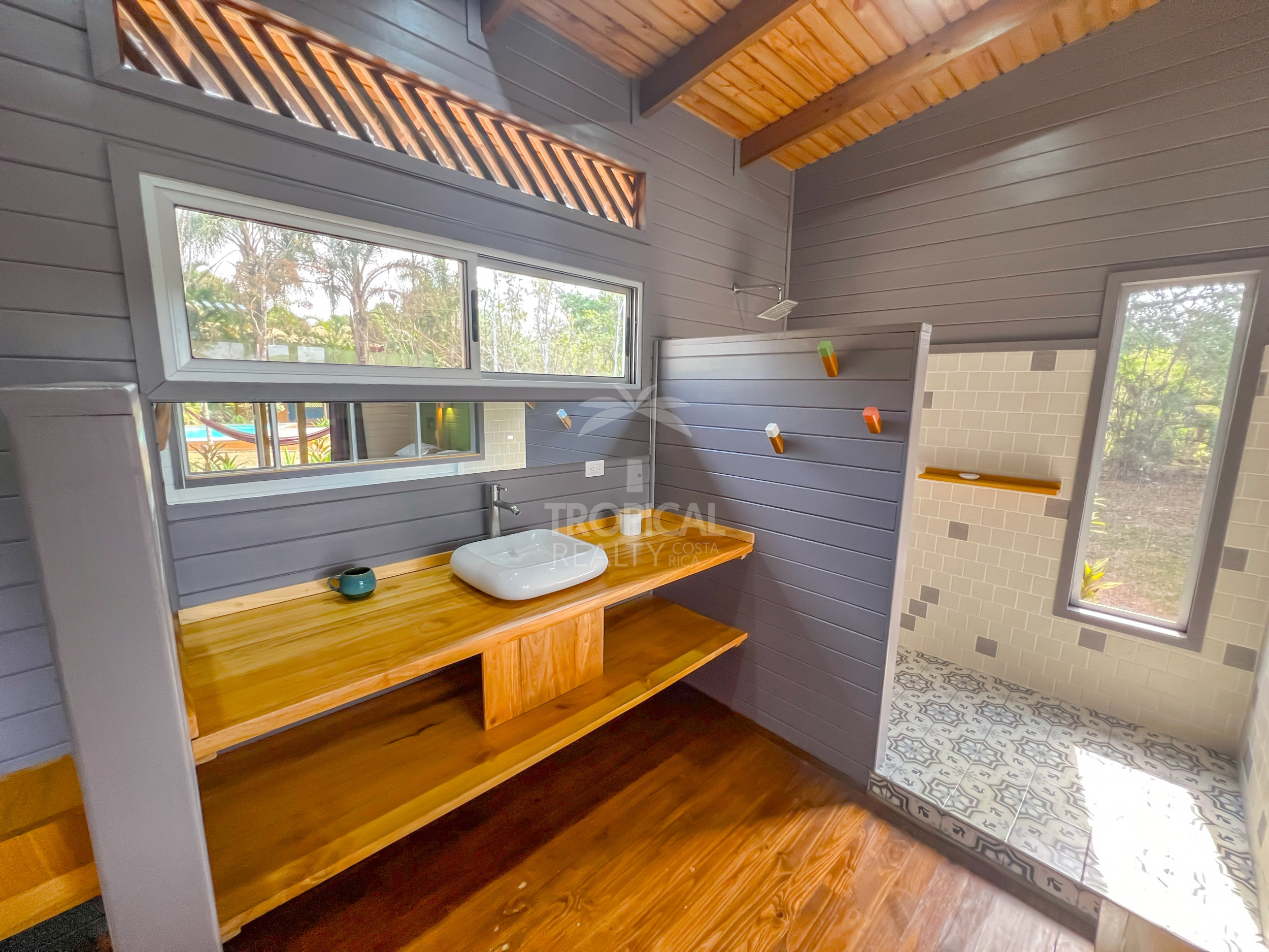 Turnkey Rental Opportunity: Charming Lodges with Pool Near Santa Teresa Beach
