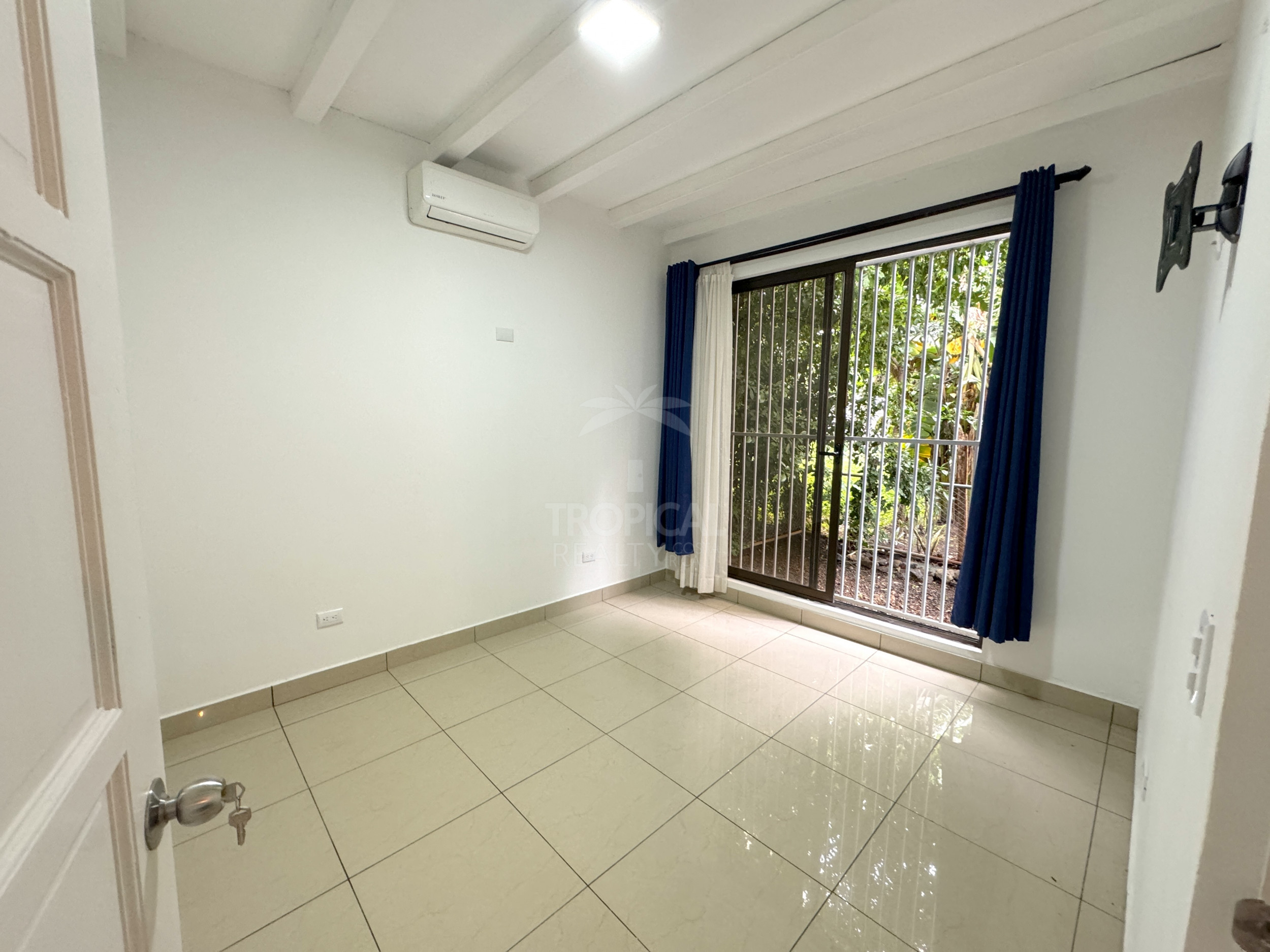 Modern Home for Sale in Playas del Coco – 2 Bedrooms, Fenced Garden, and Pool Potential