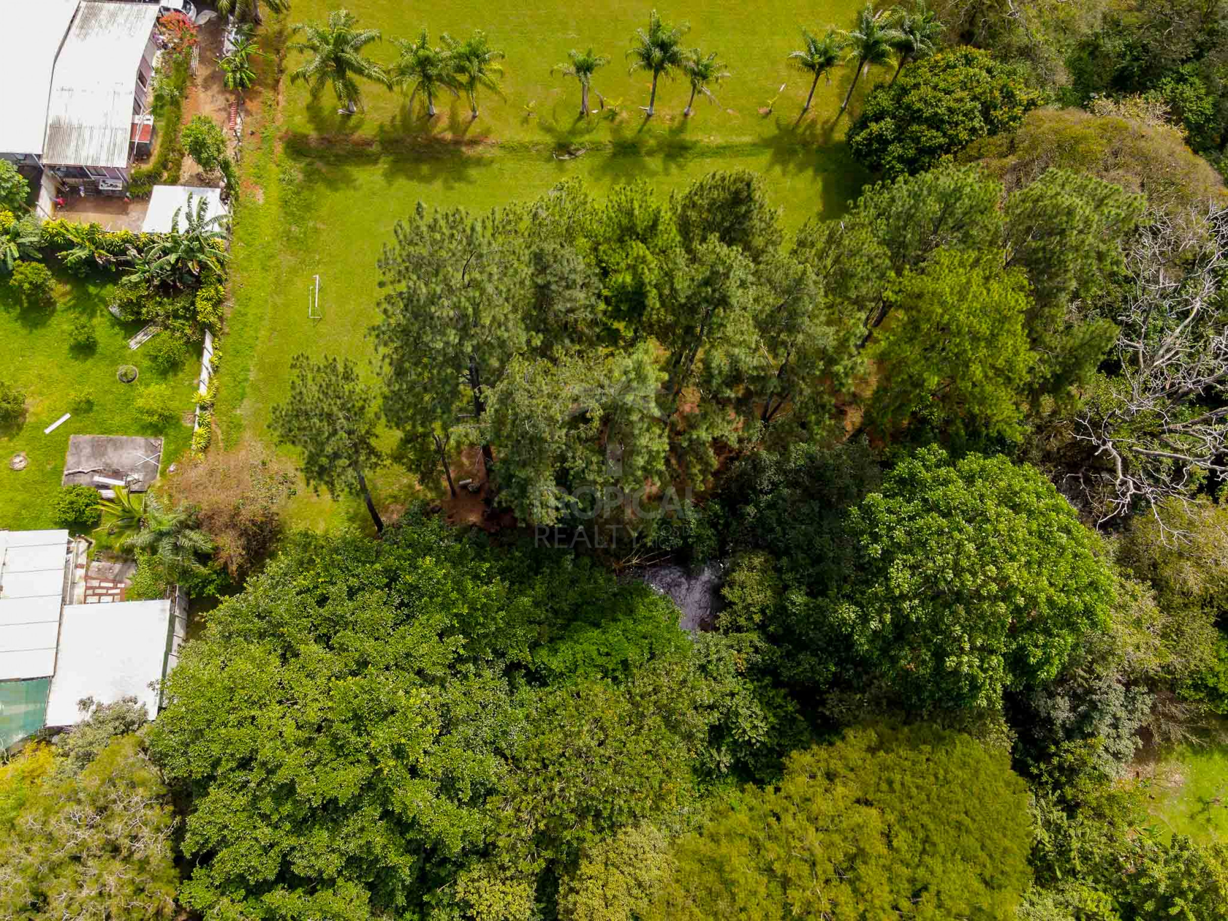 Commercial Property for Sale in La Garita – Riverfront with High Development Potential