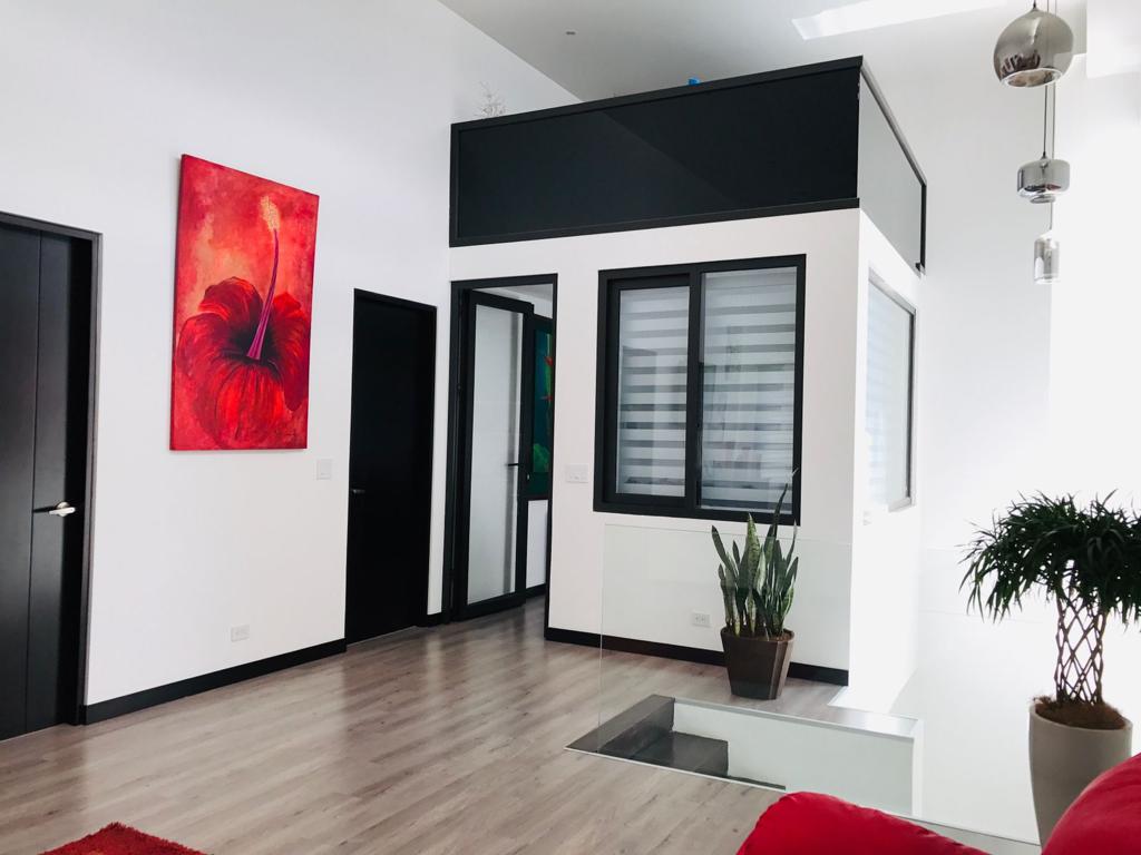 A contemporary residence located in Guachipilín Norte condominium is now available for sale SOLD